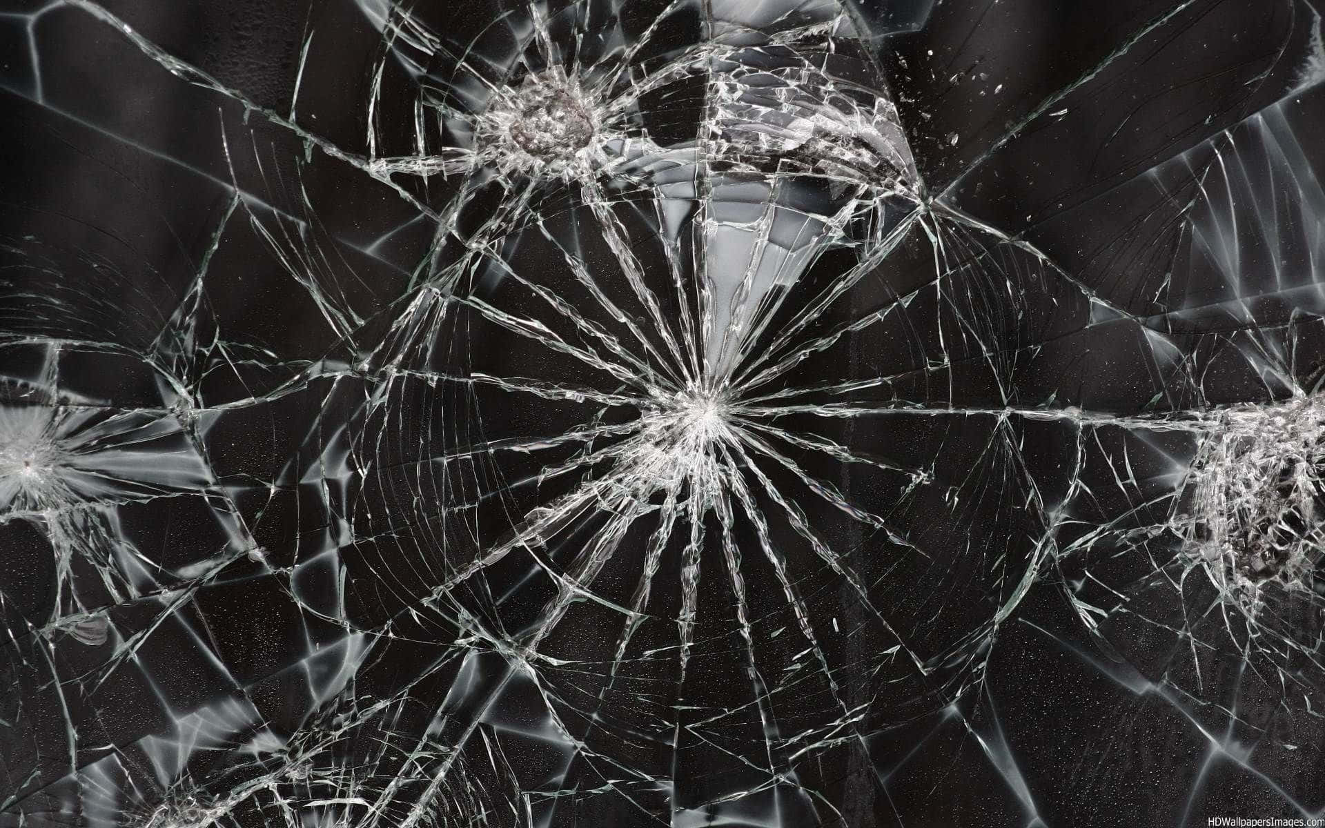 A Cracked Computer Screen showcasing a Shattered Image Wallpaper