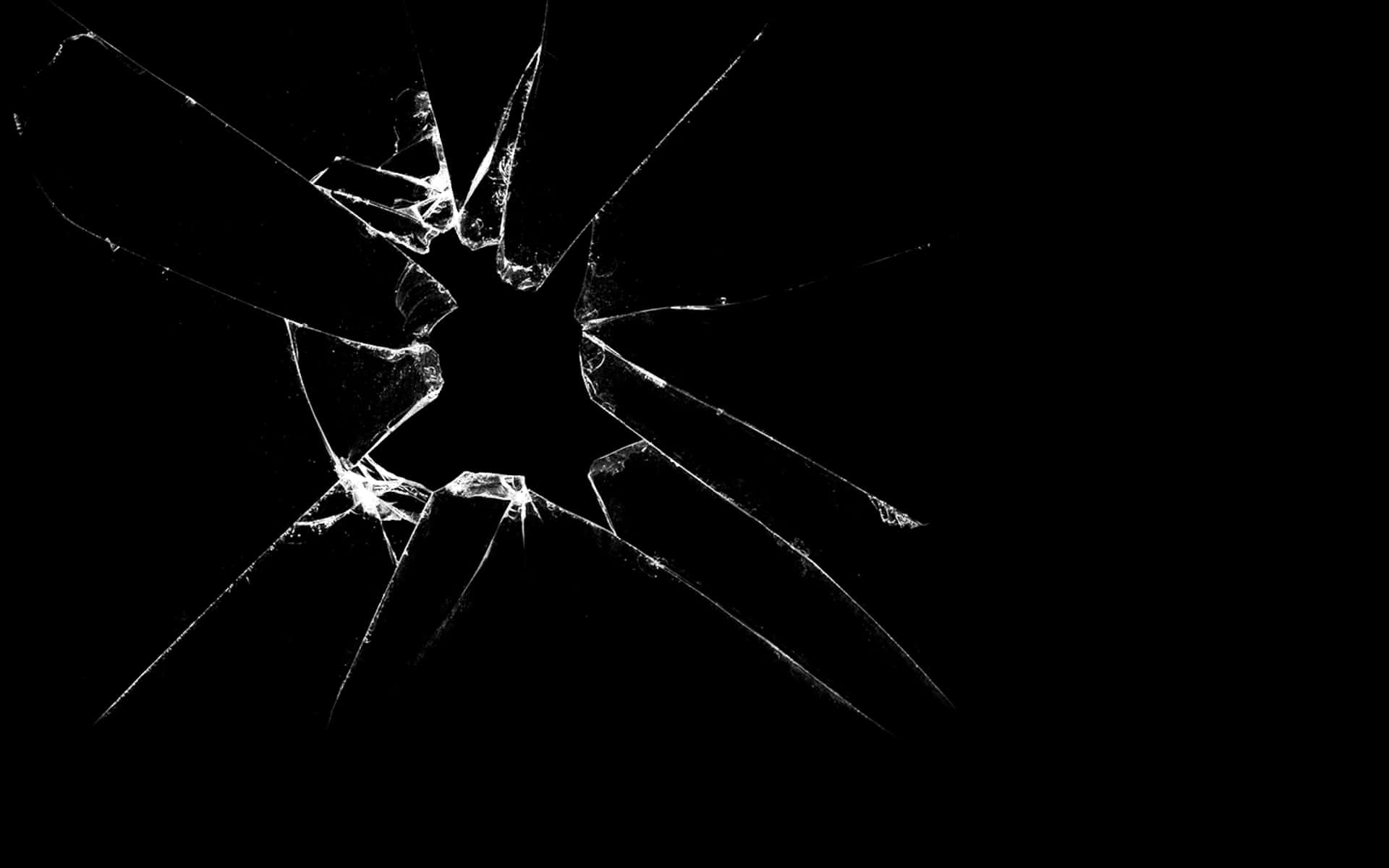 A Black And White Image Of A Broken Glass