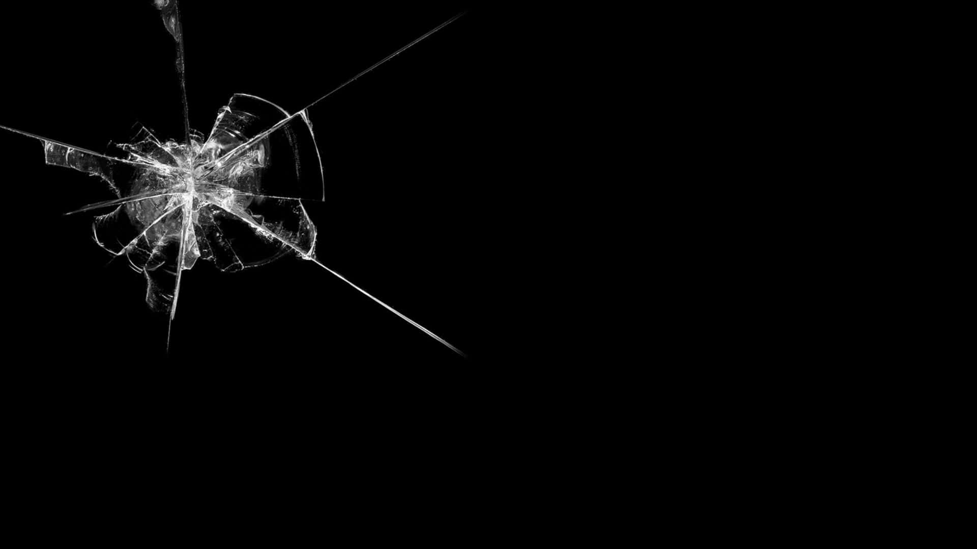 A Black Background With A Broken Glass
