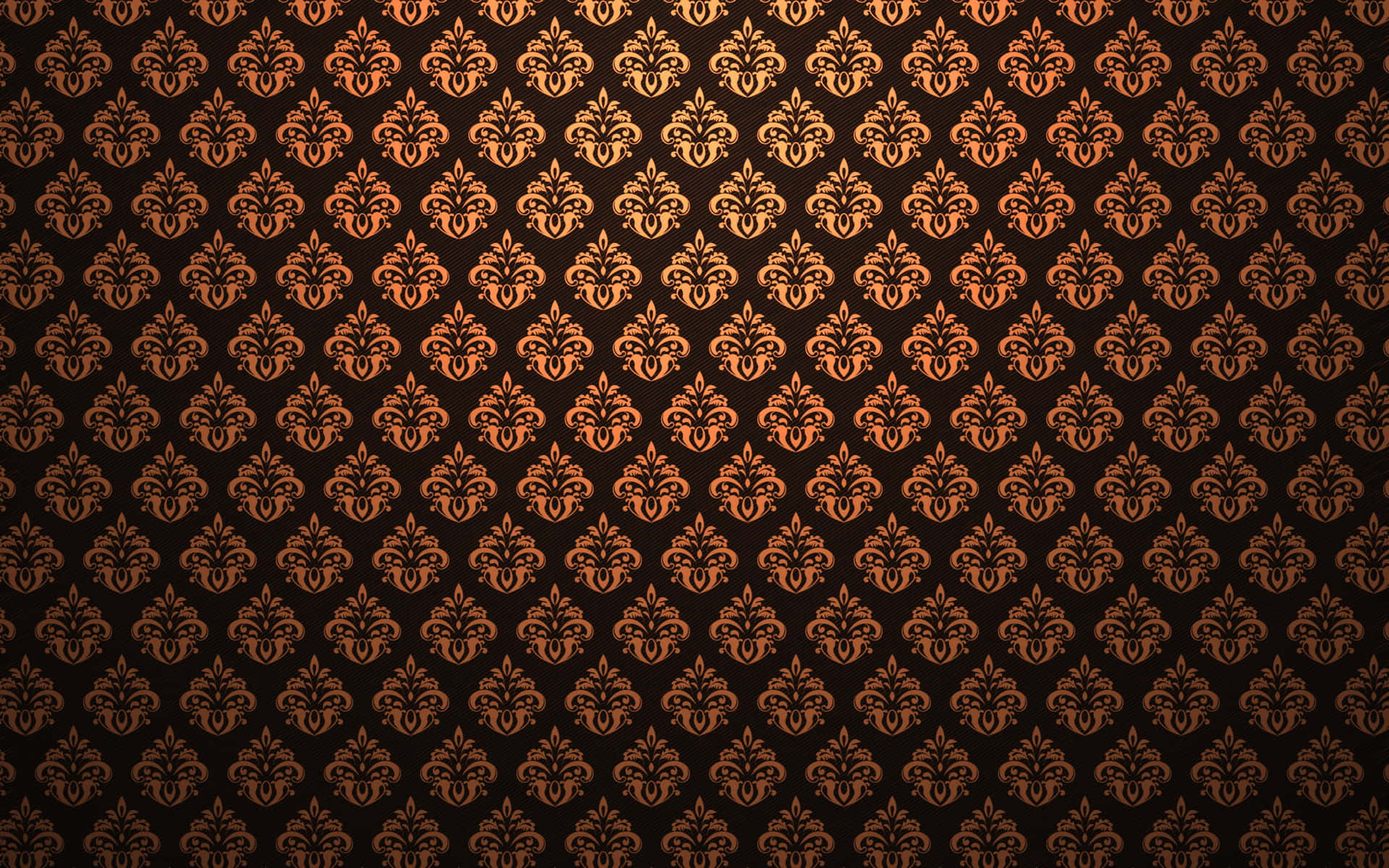 An Ornate Wallpaper With An Orange And Black Pattern