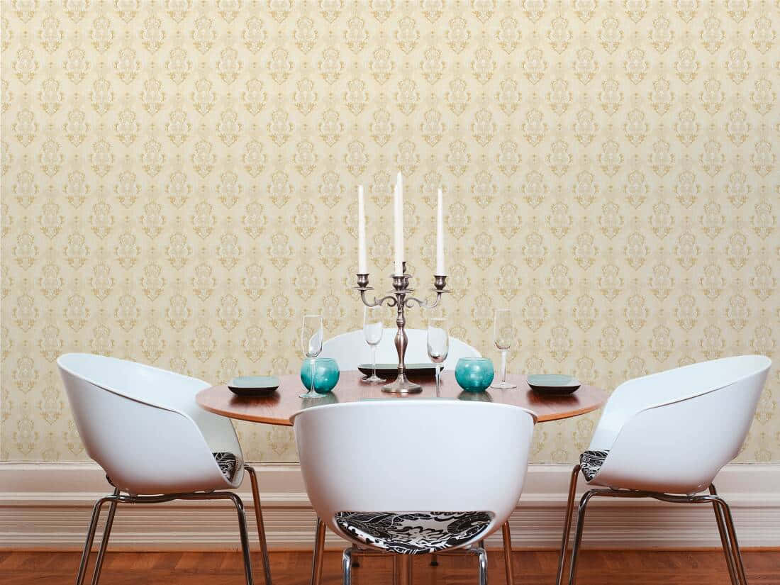 Caption: Bronze Candleholder Reflecting Classical Elegance Wallpaper