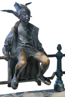 Bronze Statueof Seated Boywith Hat PNG