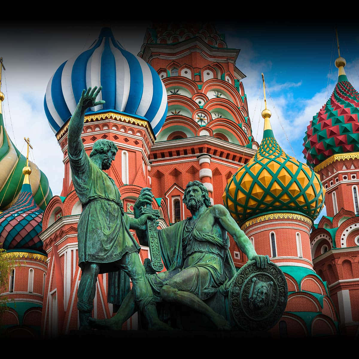 Bronze Statues Against Saint Basil's Cathedral Wallpaper