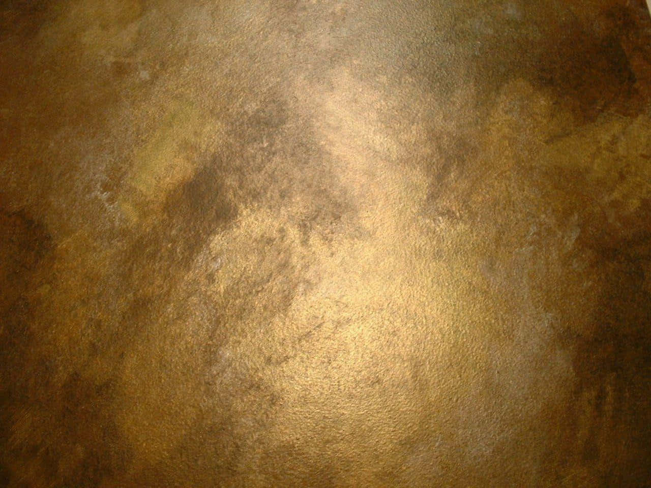 An aged bronze texture with a beautiful patina Wallpaper