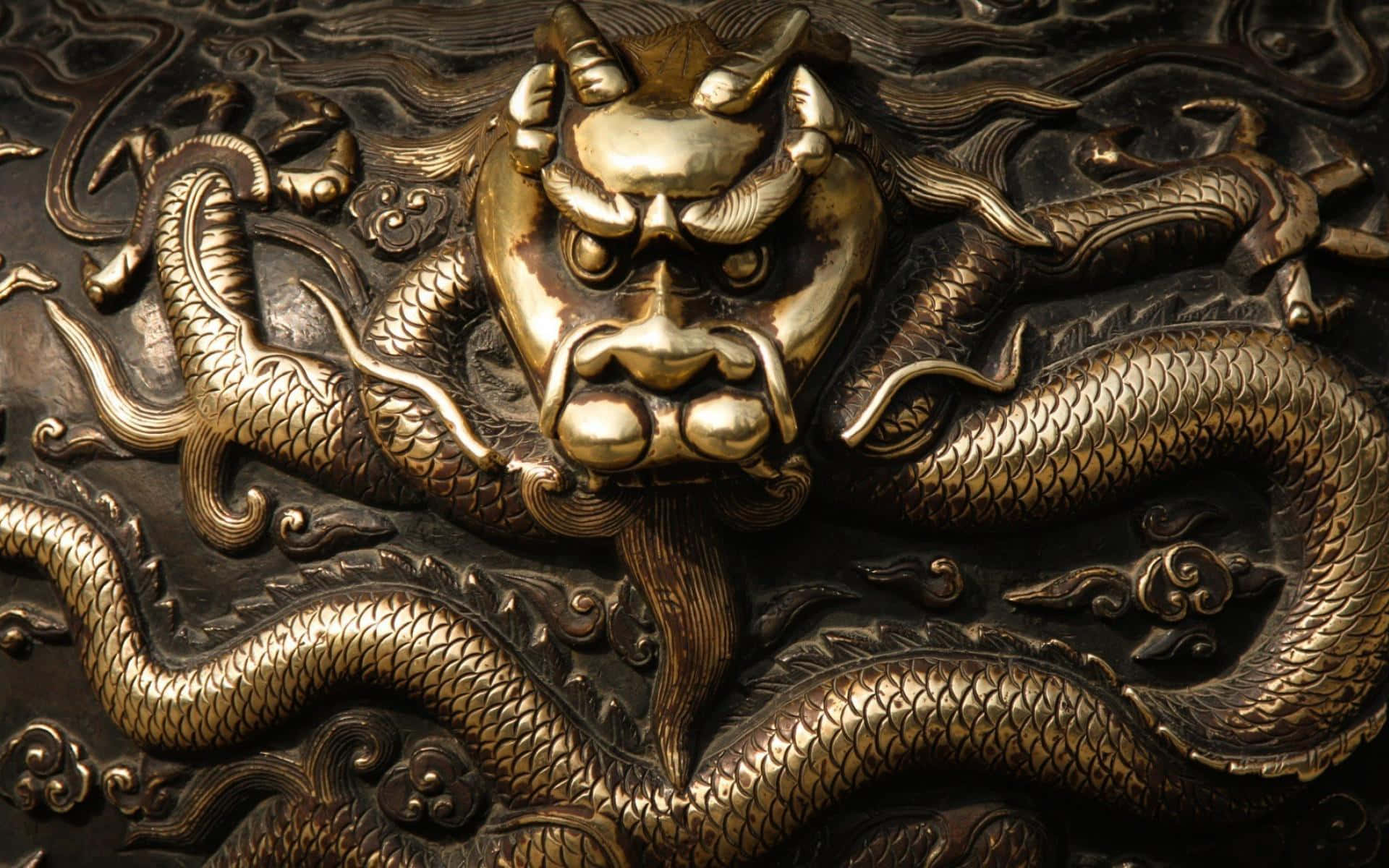 A Dragon Head On A Metal Object Wallpaper