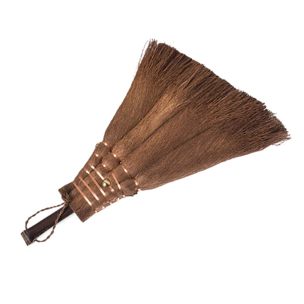 A Brown Broom With A Handle On It