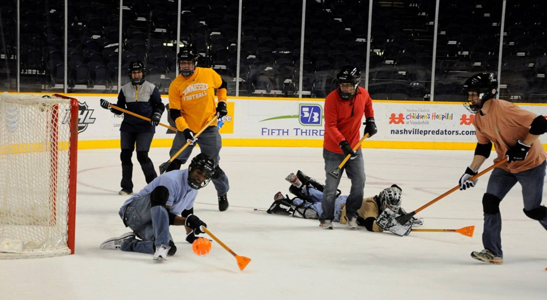 Competitive Broomball Team in Action Wallpaper