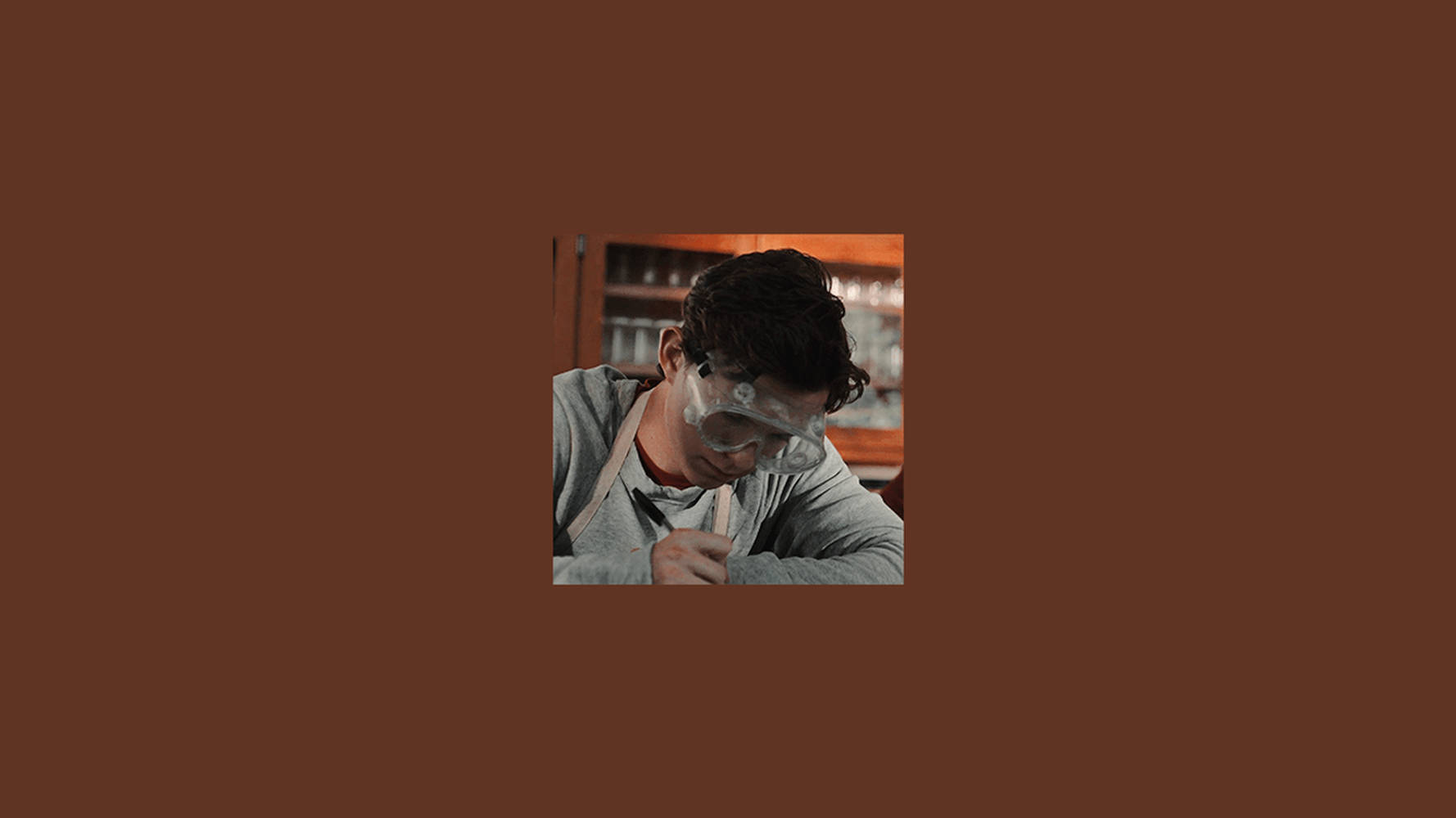 Brown Aesthetic Man With Goggles Laptop Wallpaper