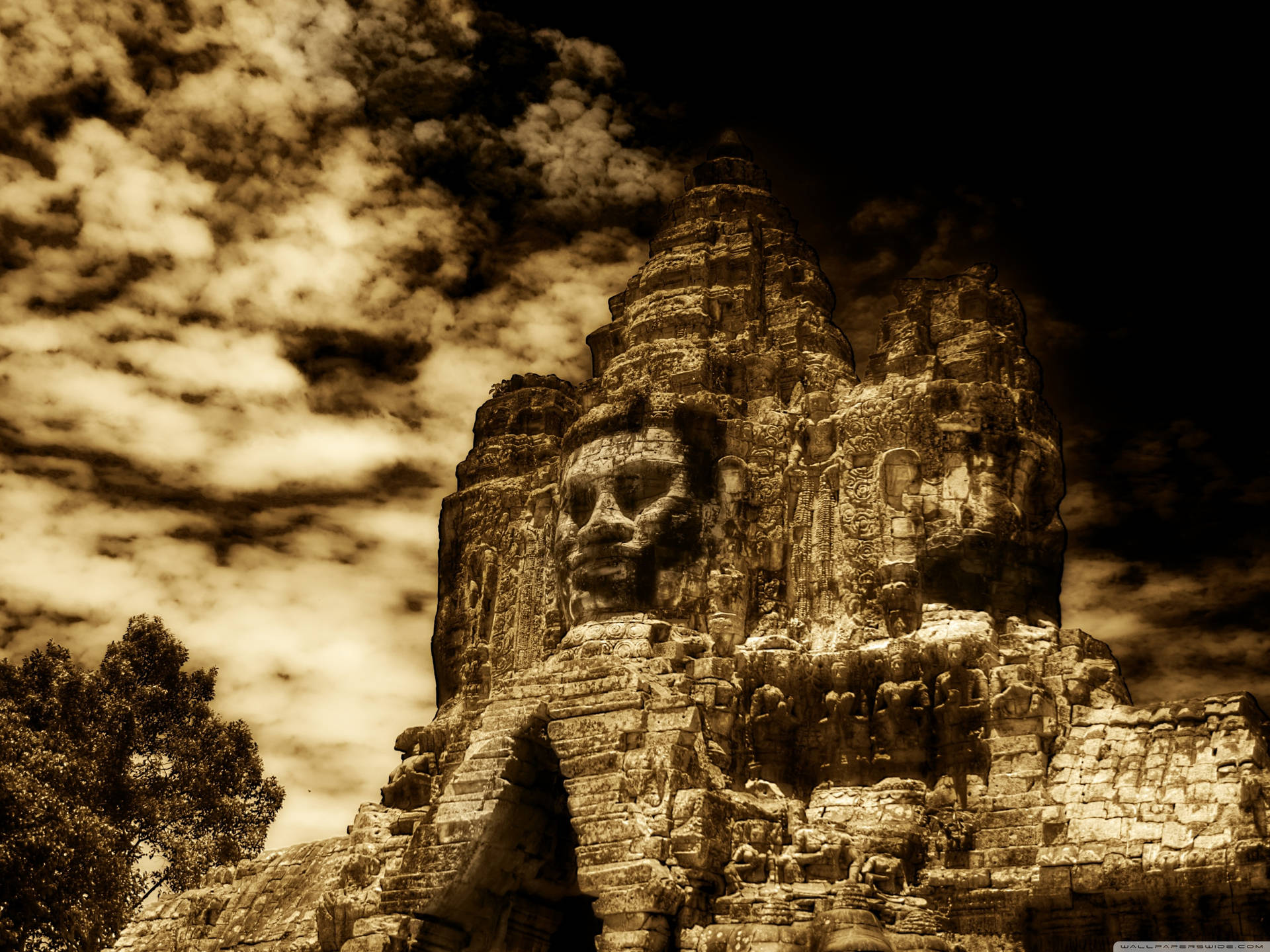 Brown Aesthetic Stone Face In Angkor Wat Wallpaper