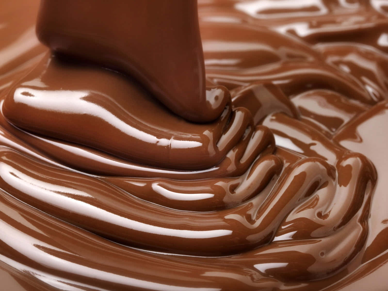 Deliciosoy Tentador Chocolate Marrón En Primer Plano. Fondo de pantalla