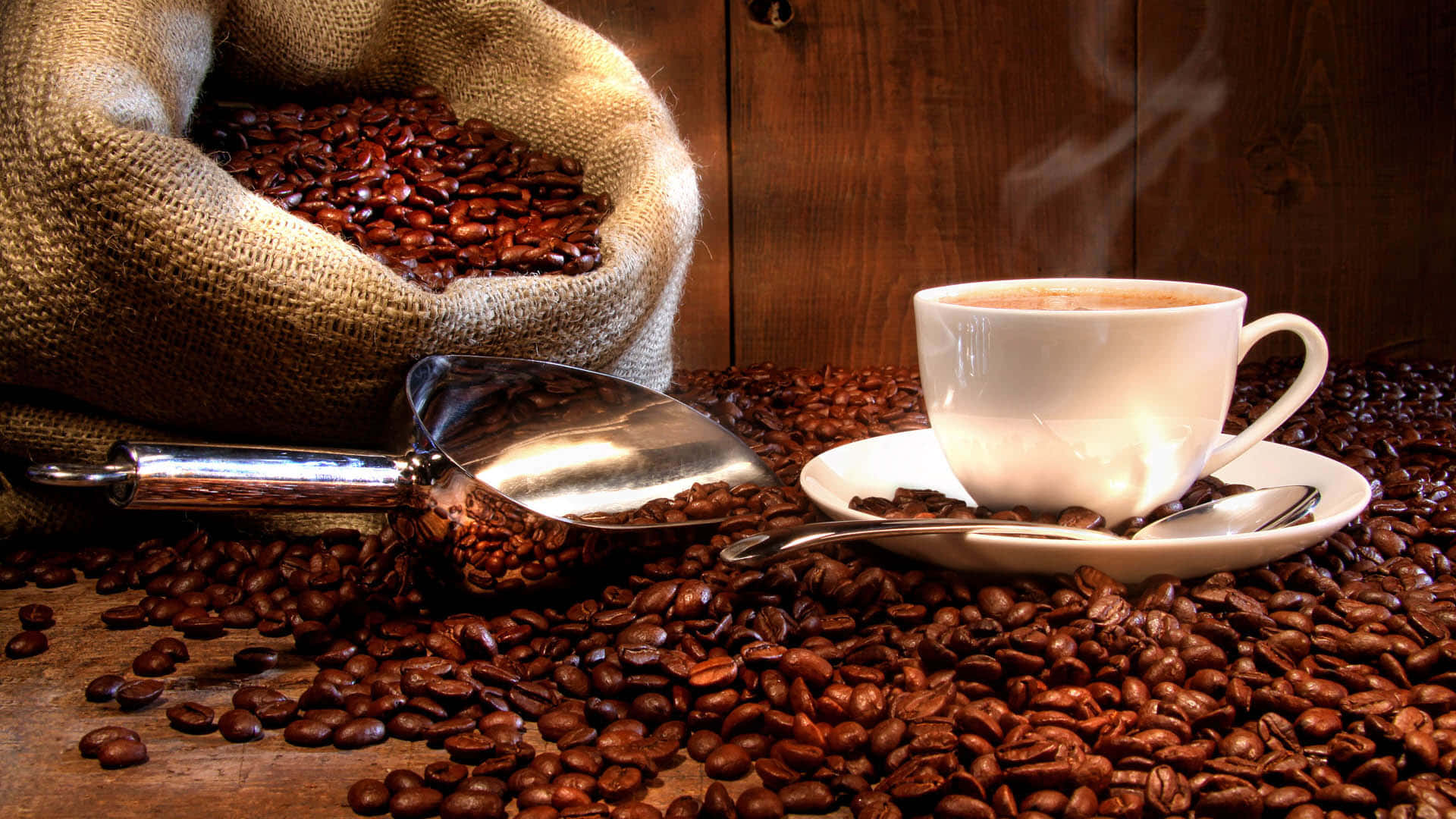 Aromatic Brown Coffee on a Wooden Table Wallpaper
