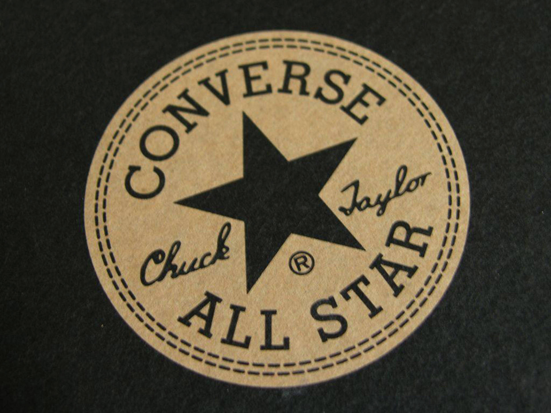 Logotipomarrom Da Converse. Papel de Parede