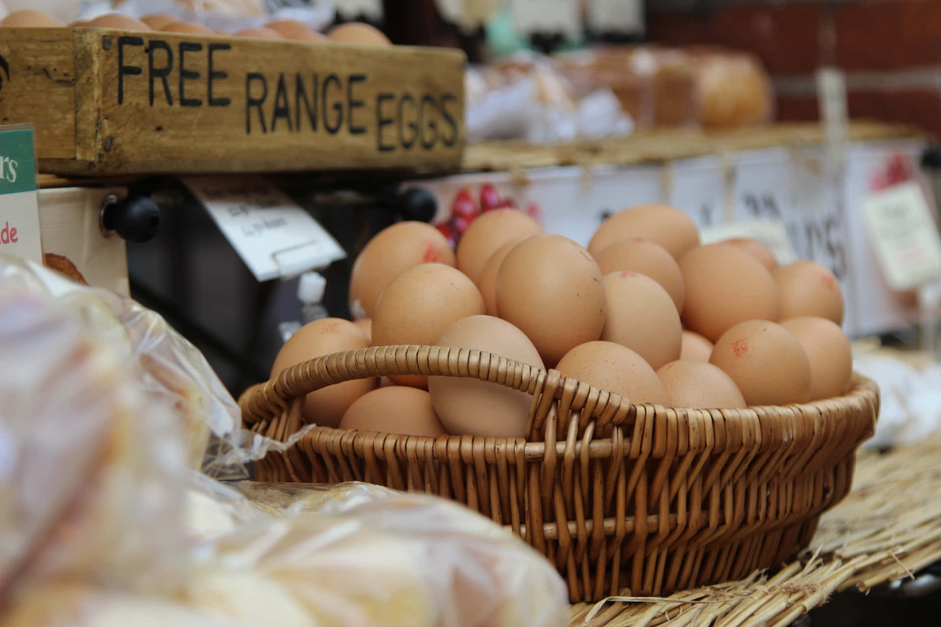 A close-up shot of organic brown eggs in a carton Wallpaper