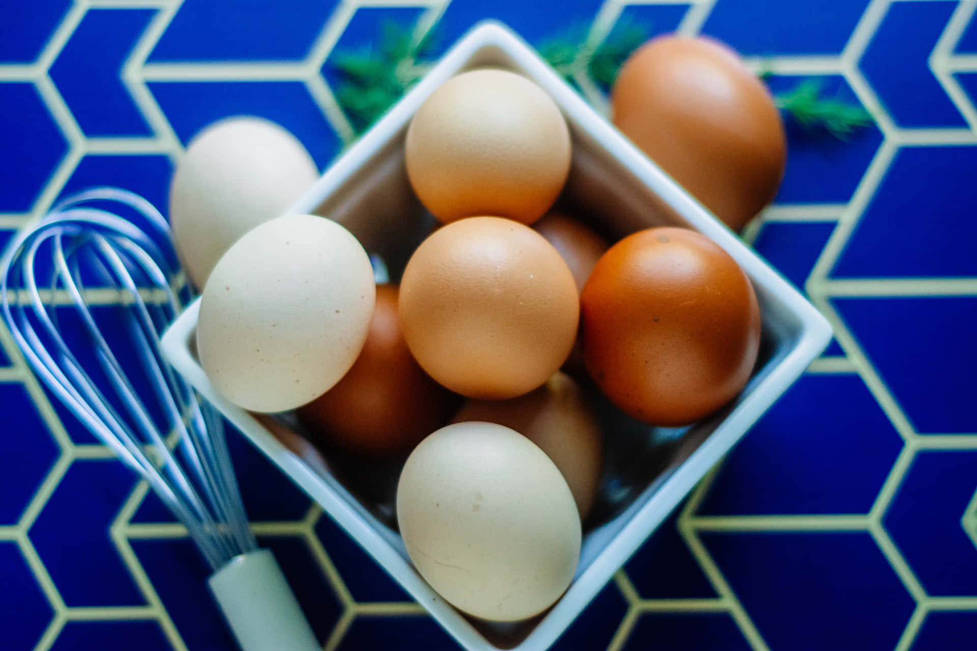 A pile of fresh brown eggs on a rustic wooden surface Wallpaper