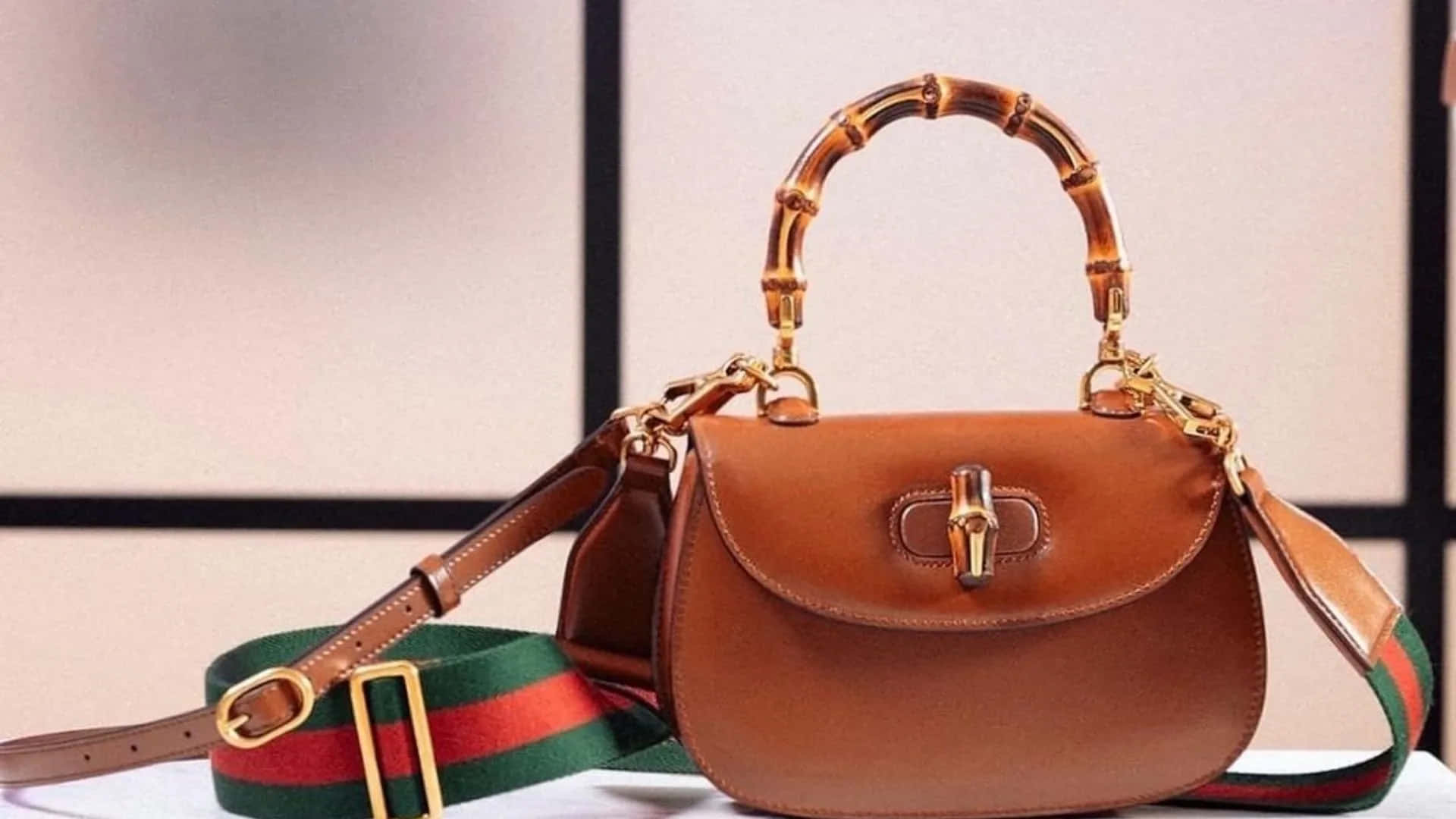 Luxury Redefined - A Brown Leather Gucci Bag in 4k Resolution Wallpaper