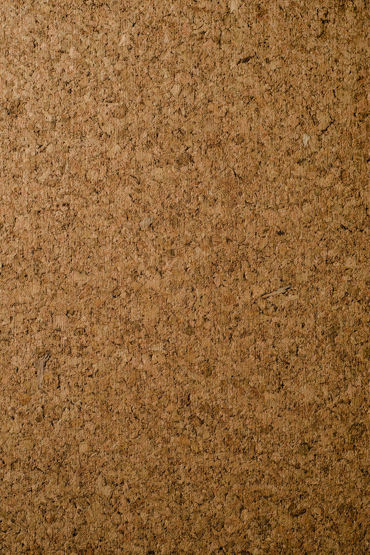 Brown Textured Corkboard Surface Wallpaper
