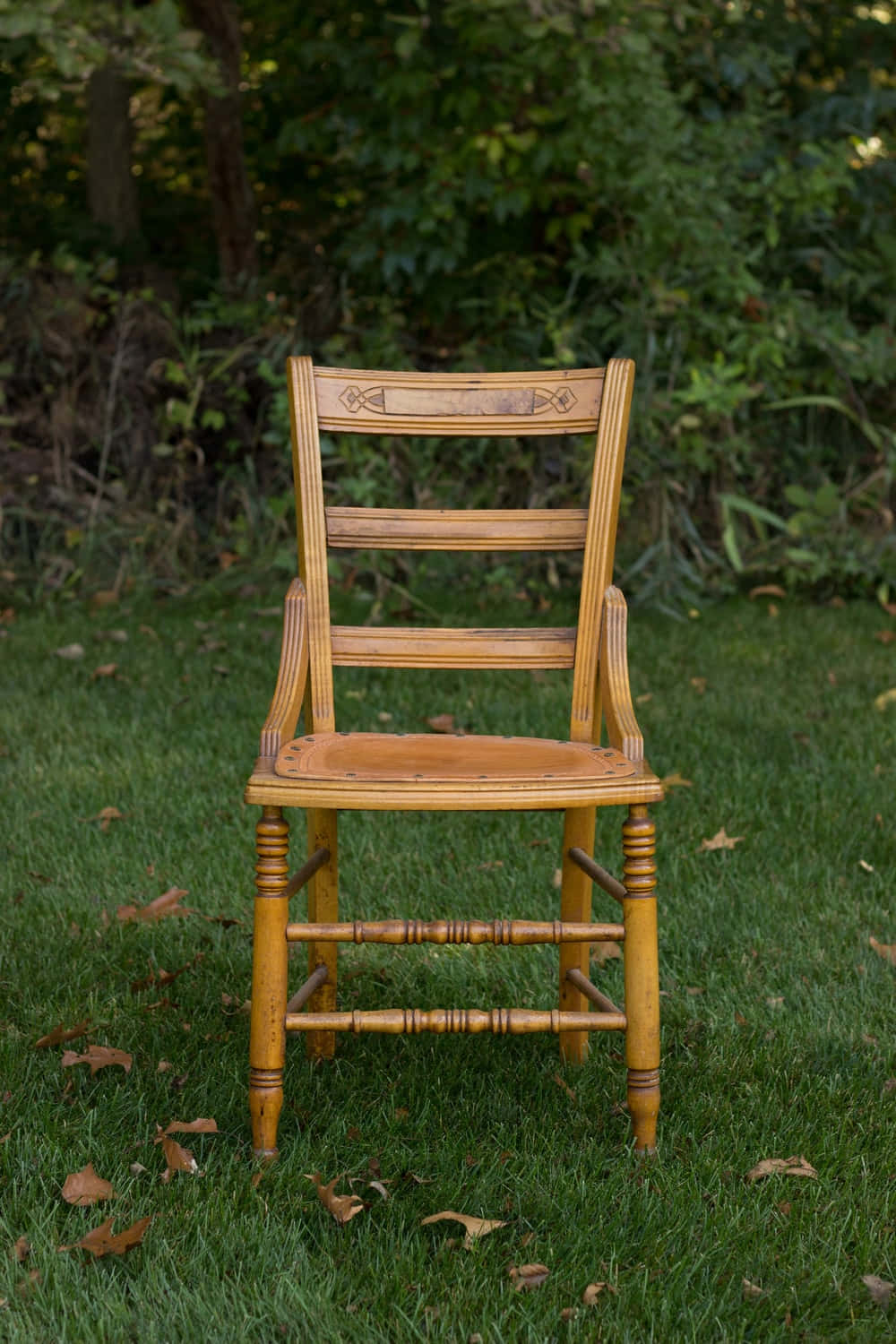 Brown Wooden Chair On Grass Wallpaper