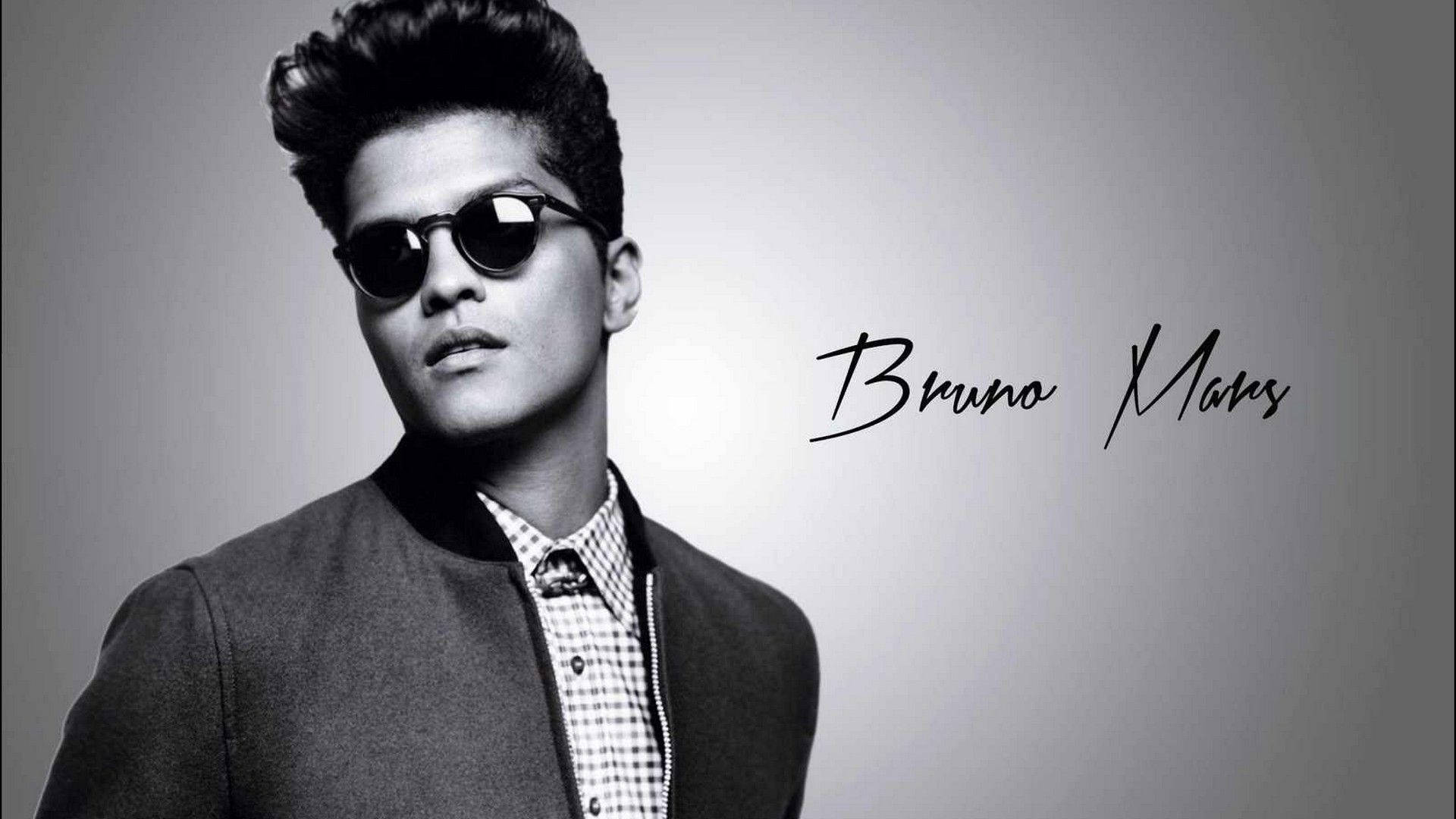 Bruno Mars all dressed up in an eye-catching outfit Wallpaper