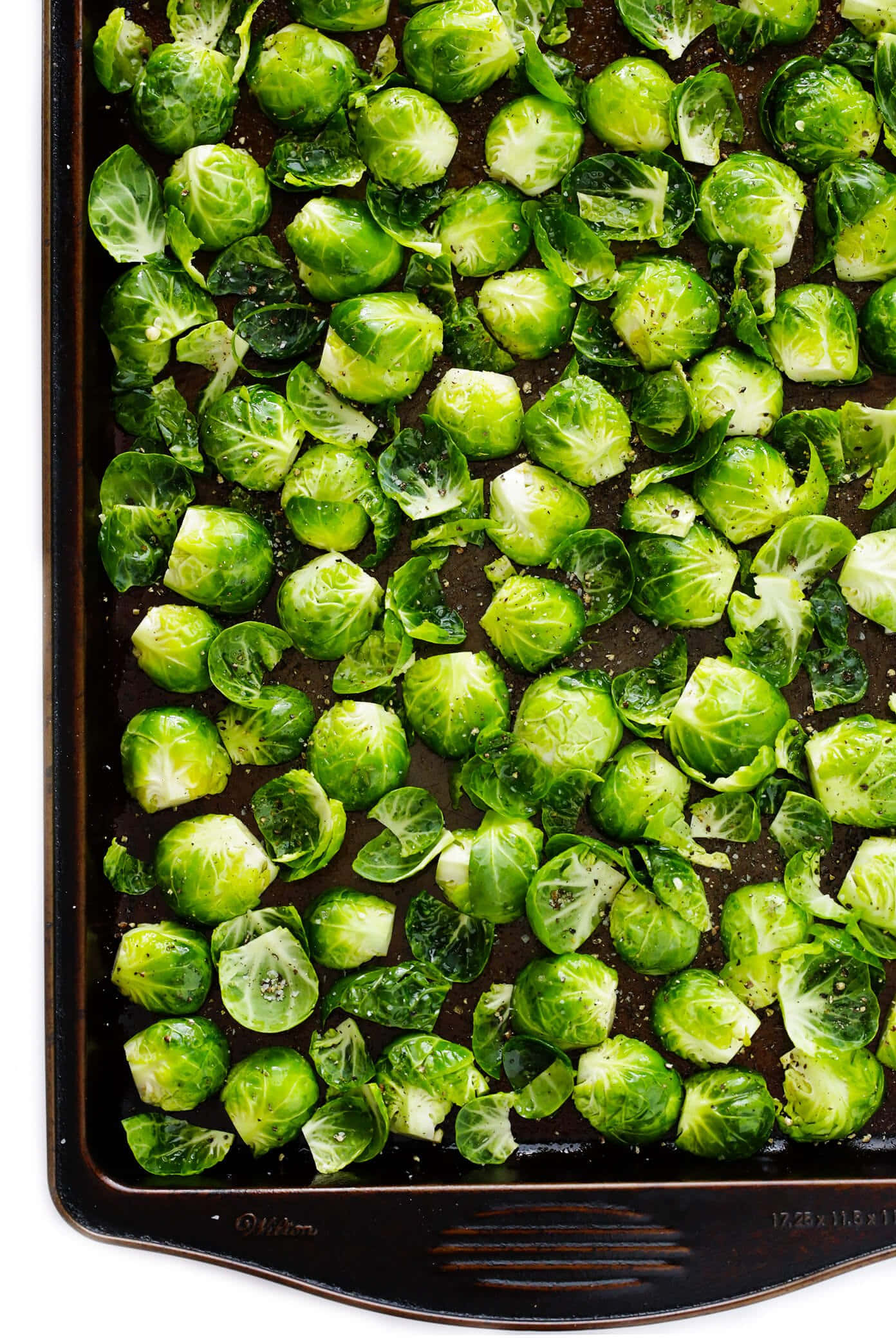 A Baking Sheet With Brussel Sprouts On It