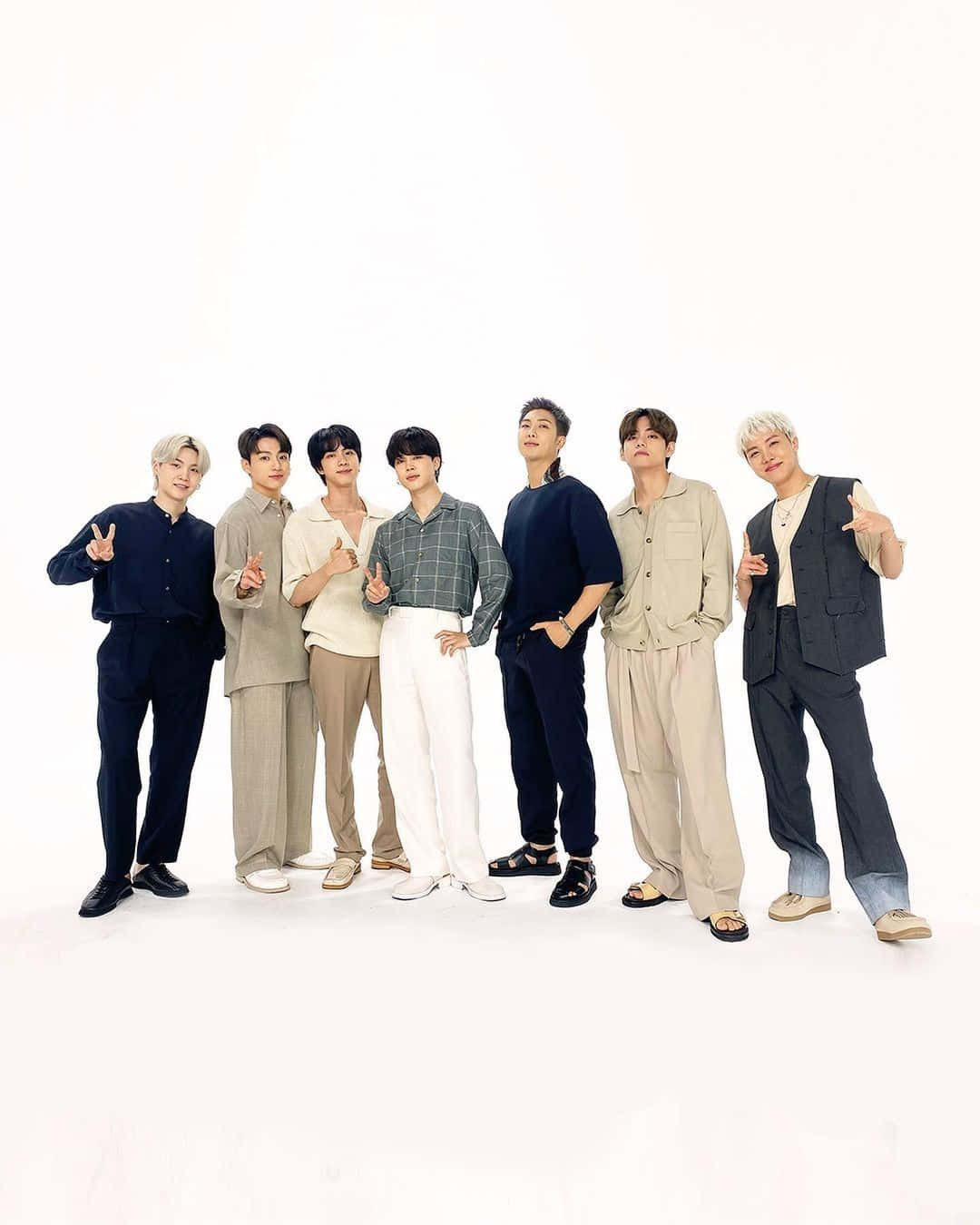 BTS posing during an endorsement event Wallpaper