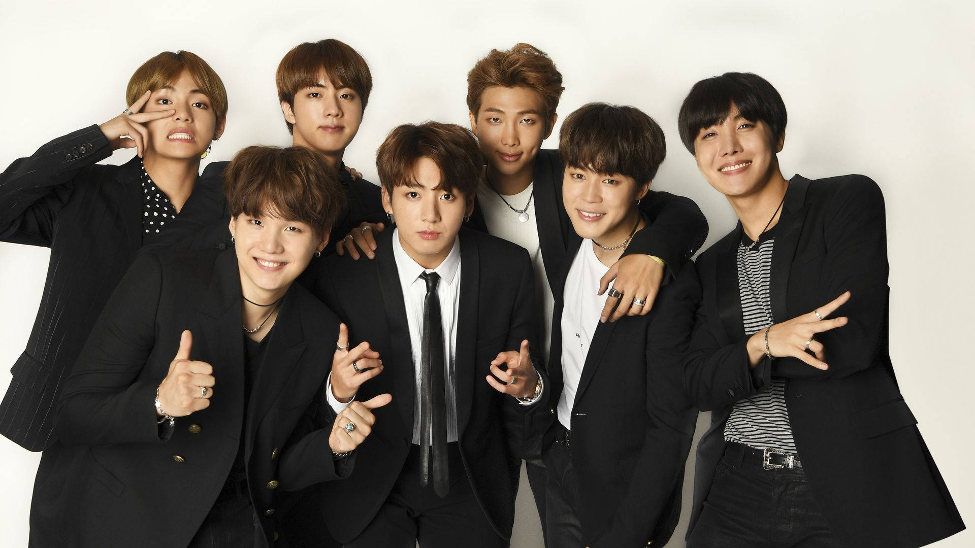 Download BTS in Black Suits, Making an Impression Wallpaper