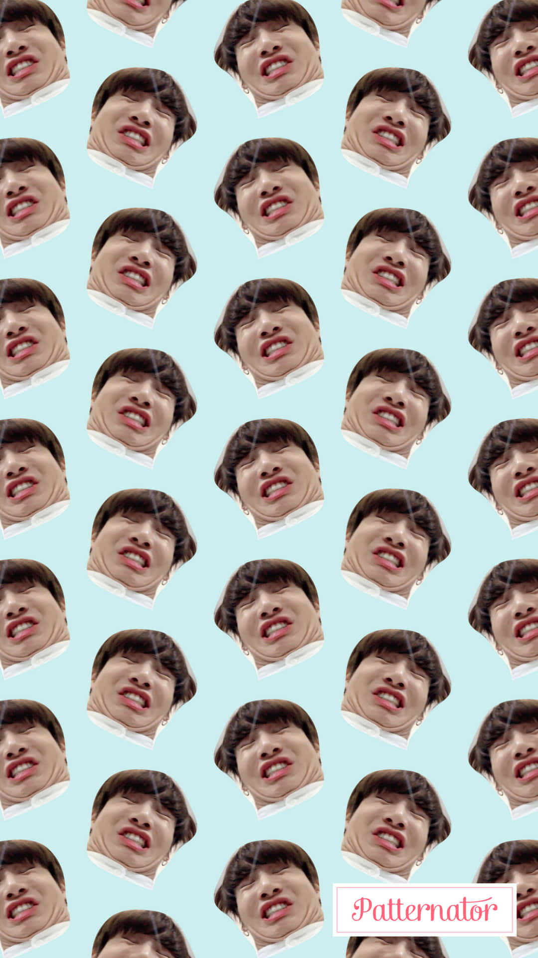 A Pattern With Many Faces Of People Wallpaper