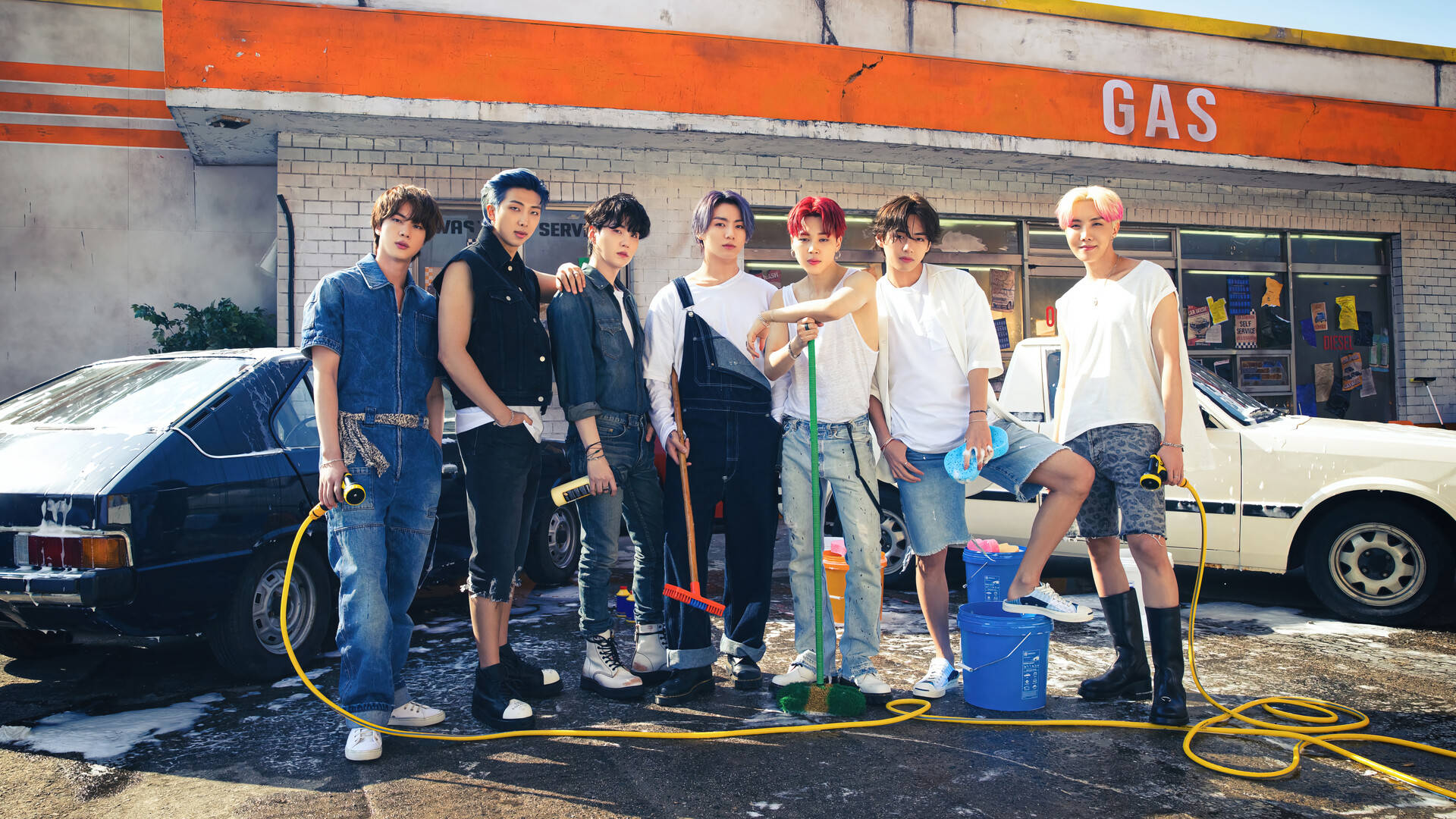 Download BTS Group Photo At Carwash Station Wallpaper | Wallpapers.com
