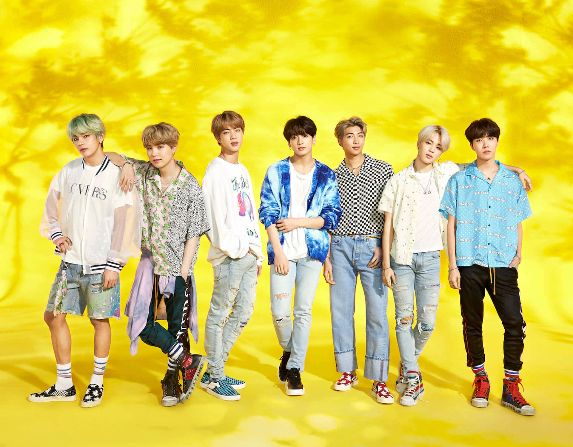 BTS in a Vibrant Music Video Scene Wallpaper