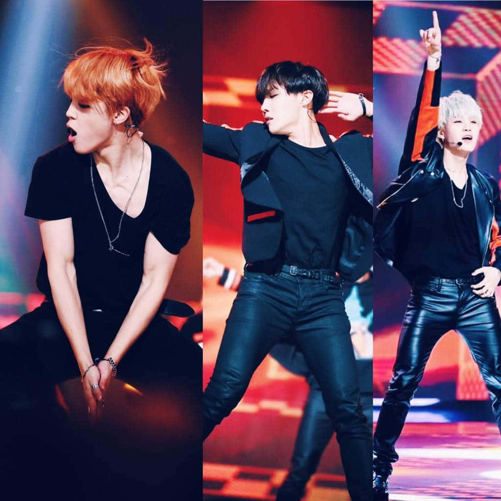 BTS performing on stage with their powerful dance moves and captivating vocals Wallpaper