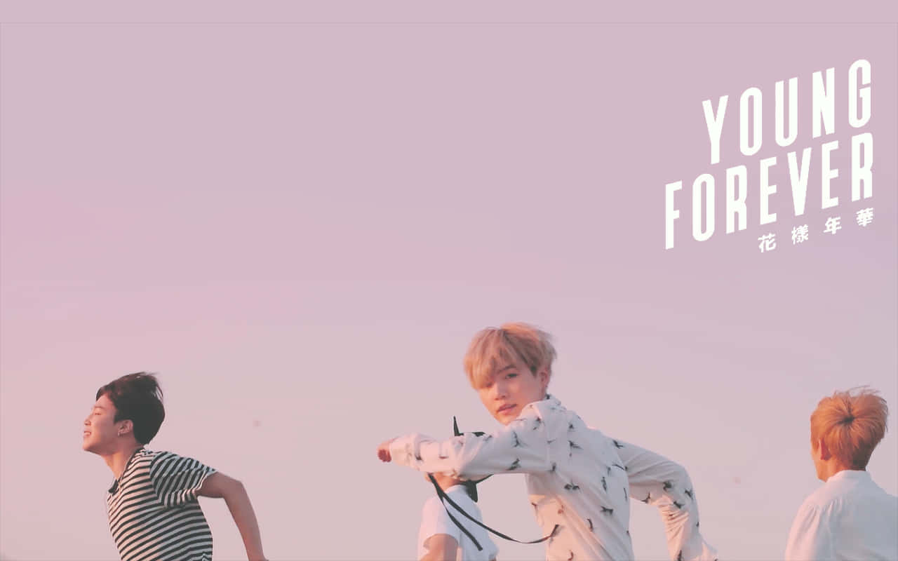Get lost in the dreamy pink aesthetic of BTS with this desktop wallpaper Wallpaper
