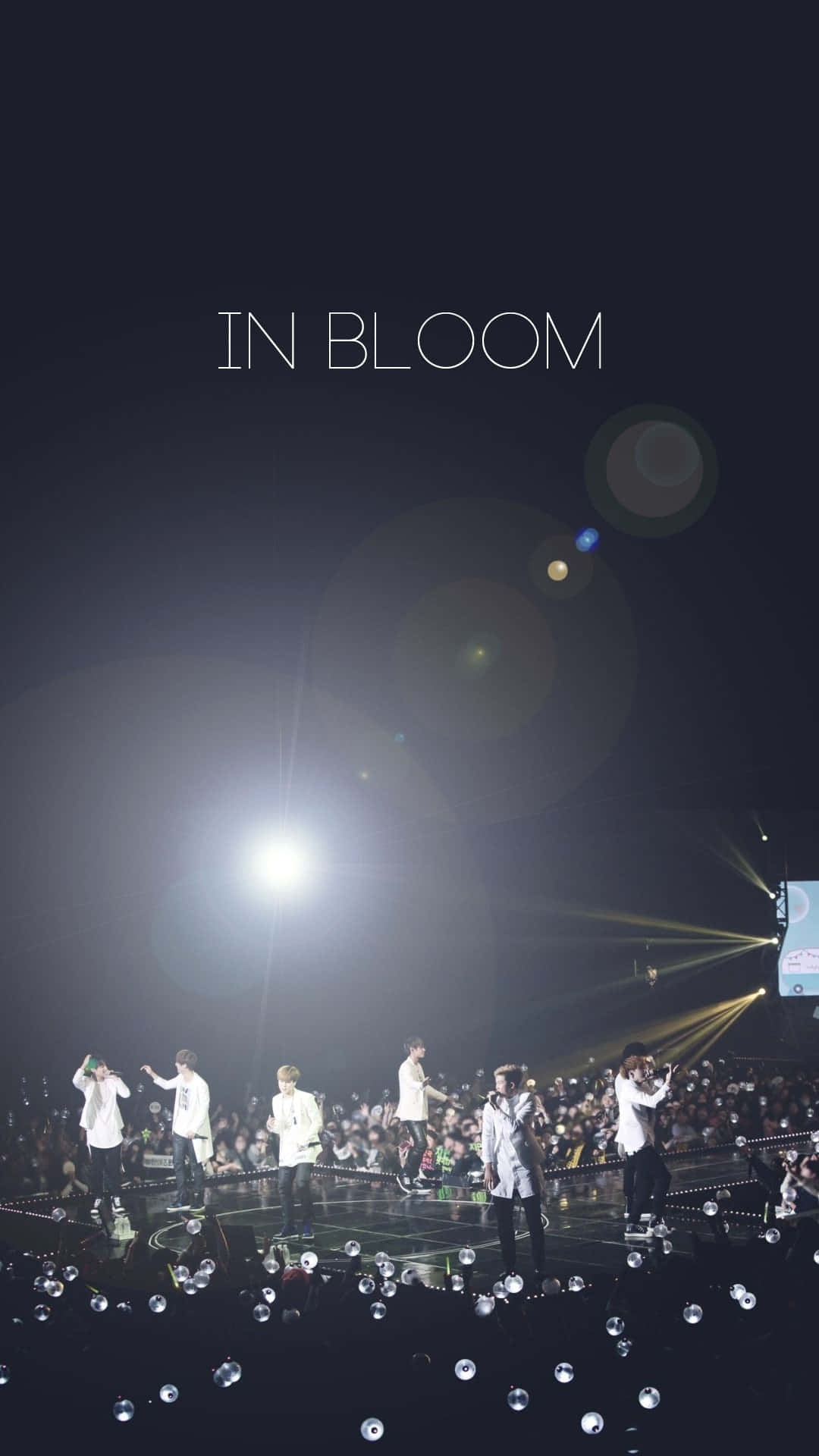 BTS Performing on Stage at a Concert Wallpaper