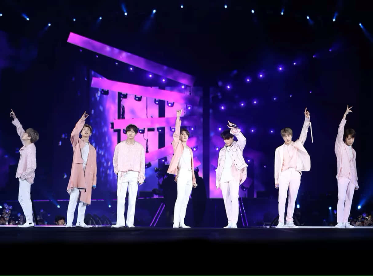 Captivating moment of BTS performing on stage Wallpaper