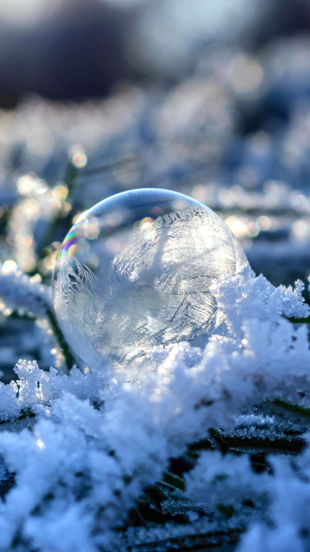 A Bubble Sitting On Top Of Snow Wallpaper