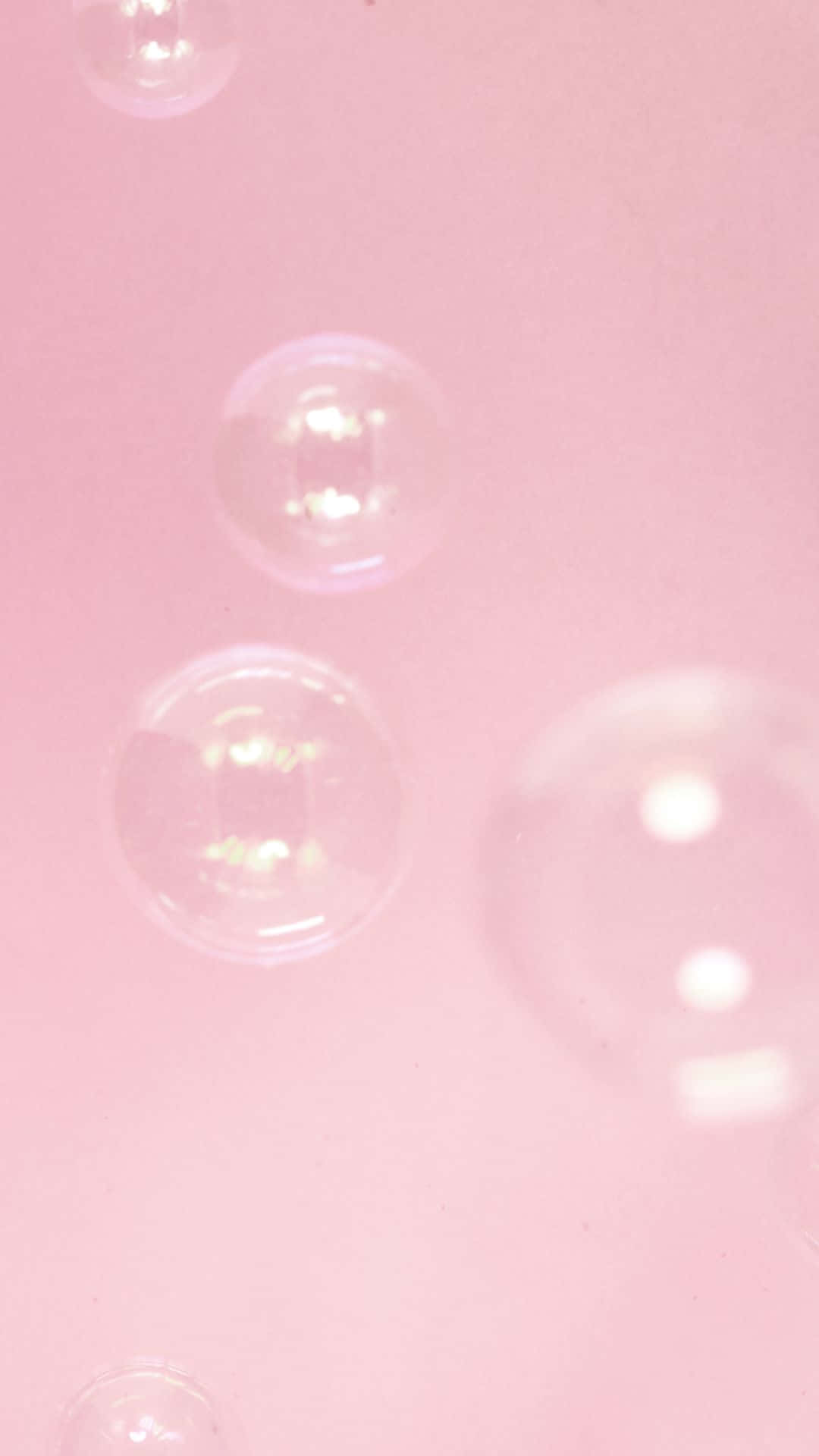 Bubbles Floating In A Pink Liquid Wallpaper