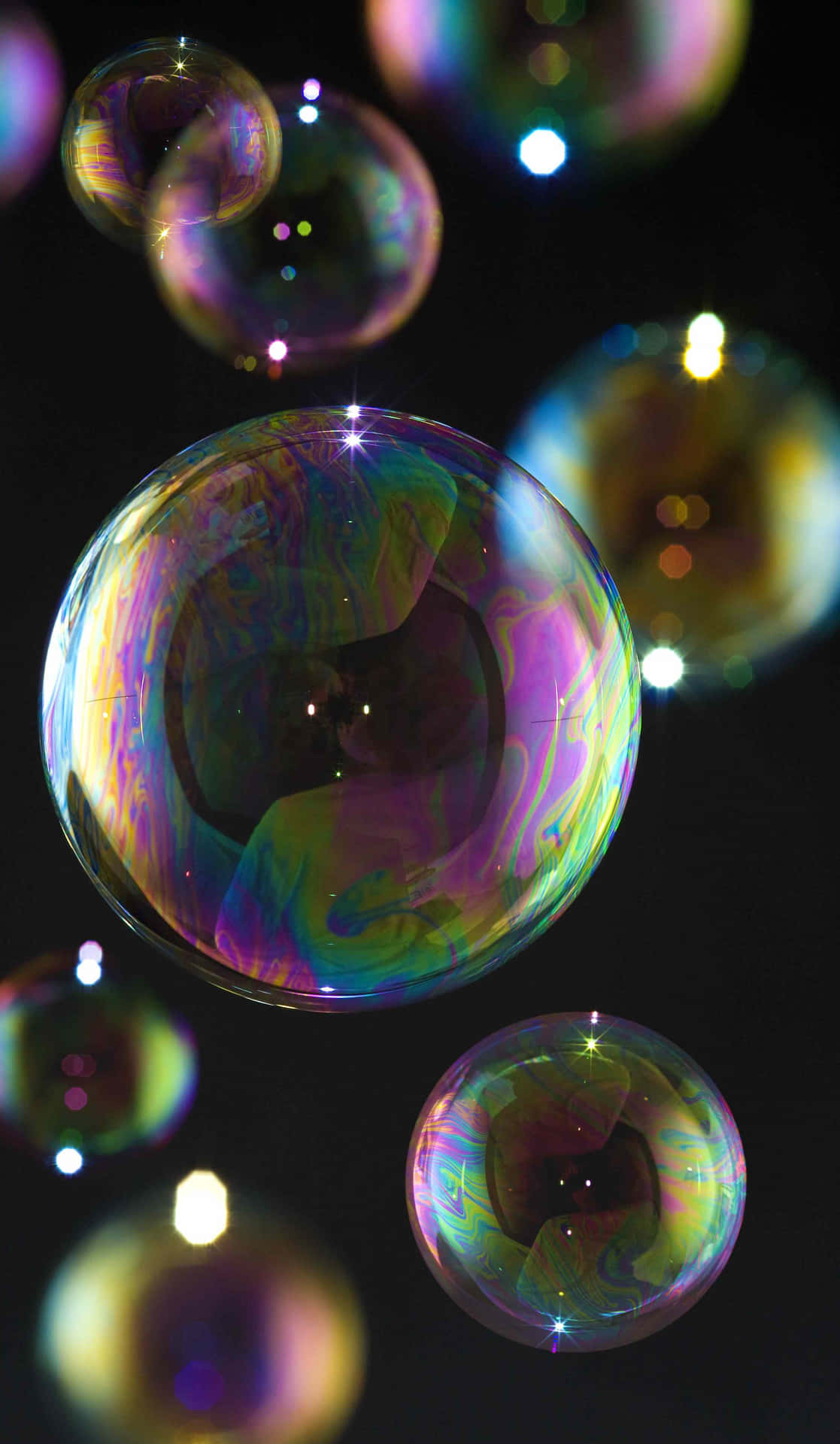 Touch the Future with Bubbles Phone Wallpaper