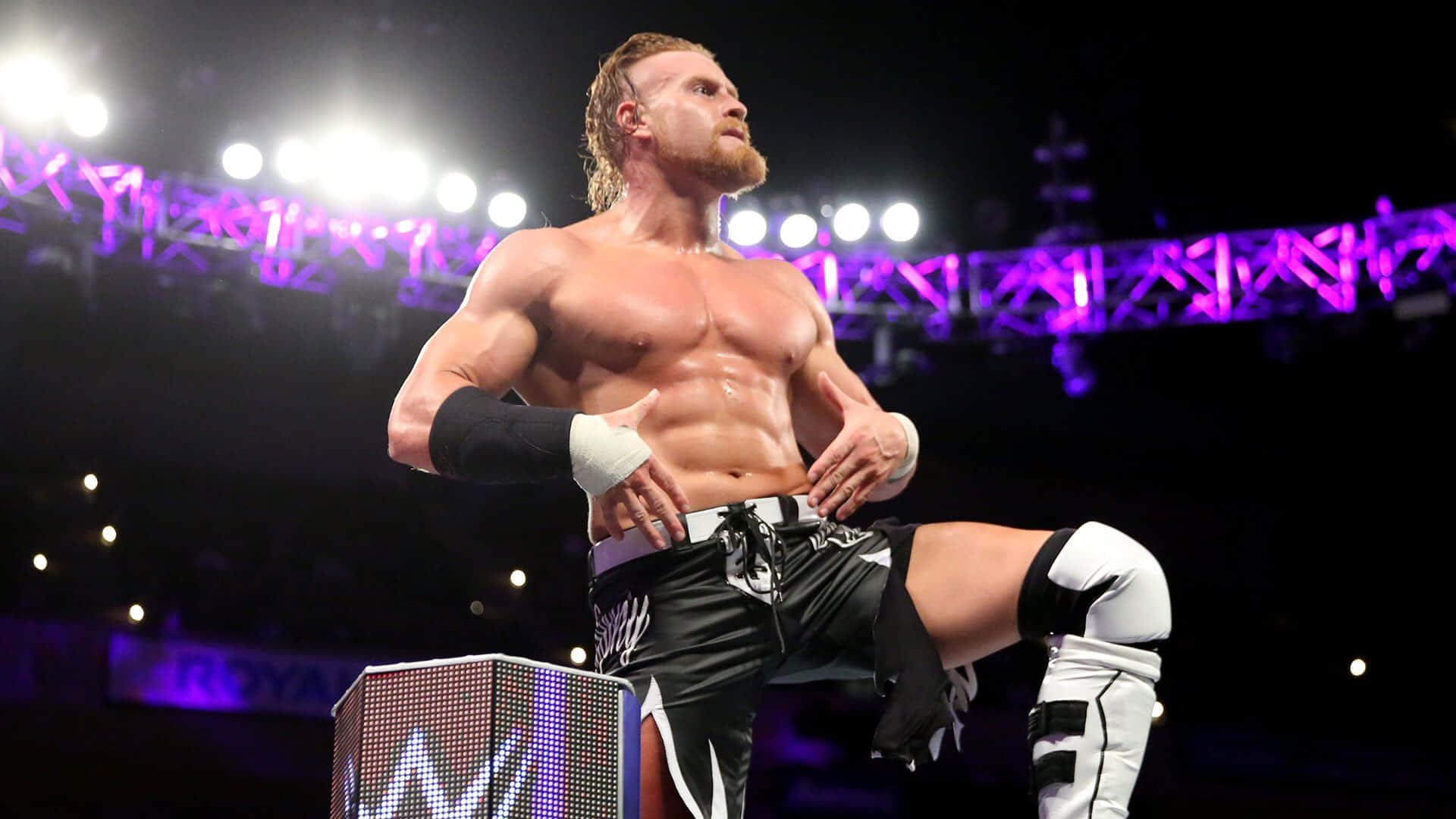 Buddy Murphy striking a powerful pose at WWE 205 Live event. Wallpaper