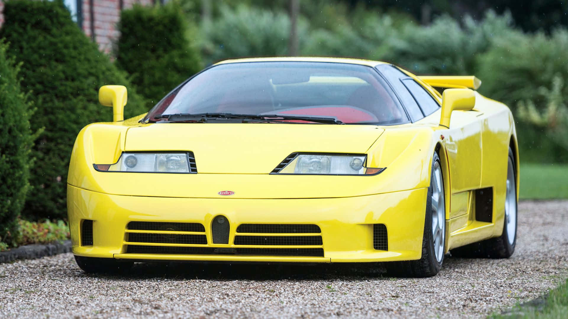 Sleek and Luxurious Bugatti EB110 in Action Wallpaper