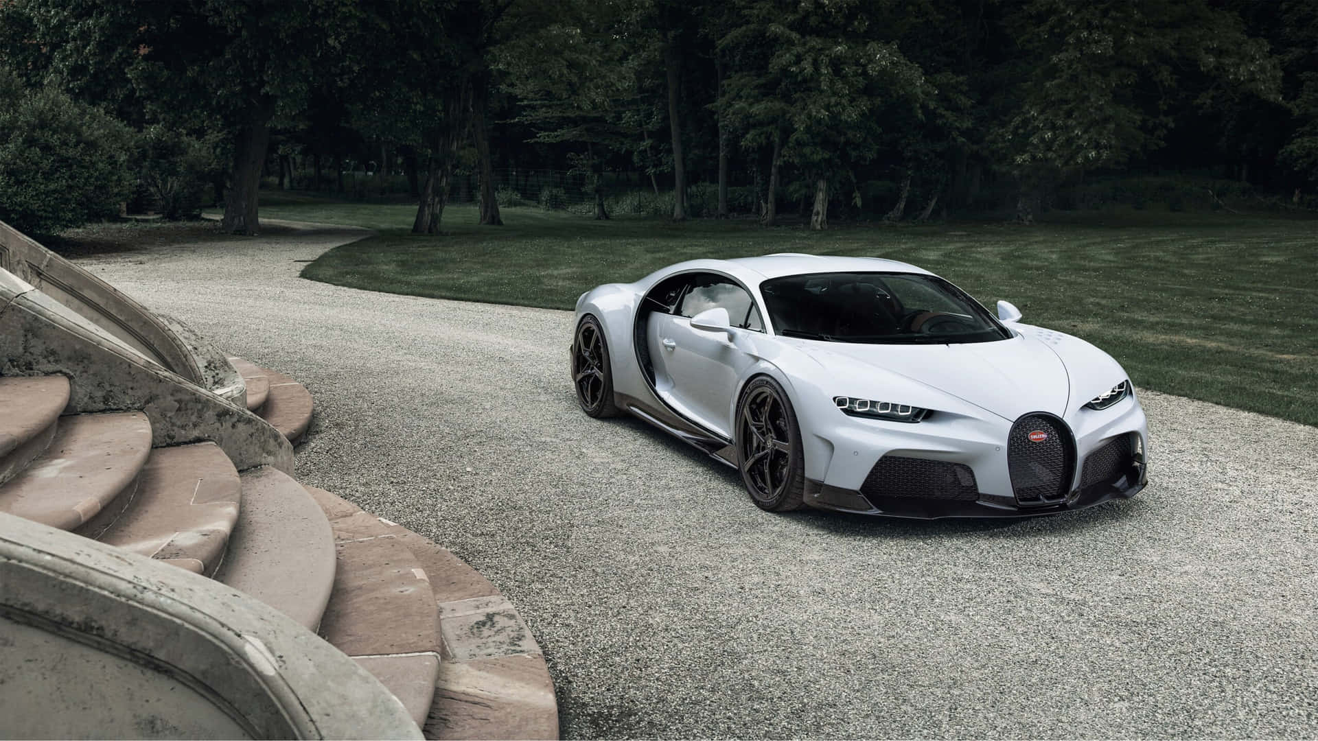 The White Bugatti Chiron Is Parked On A Path