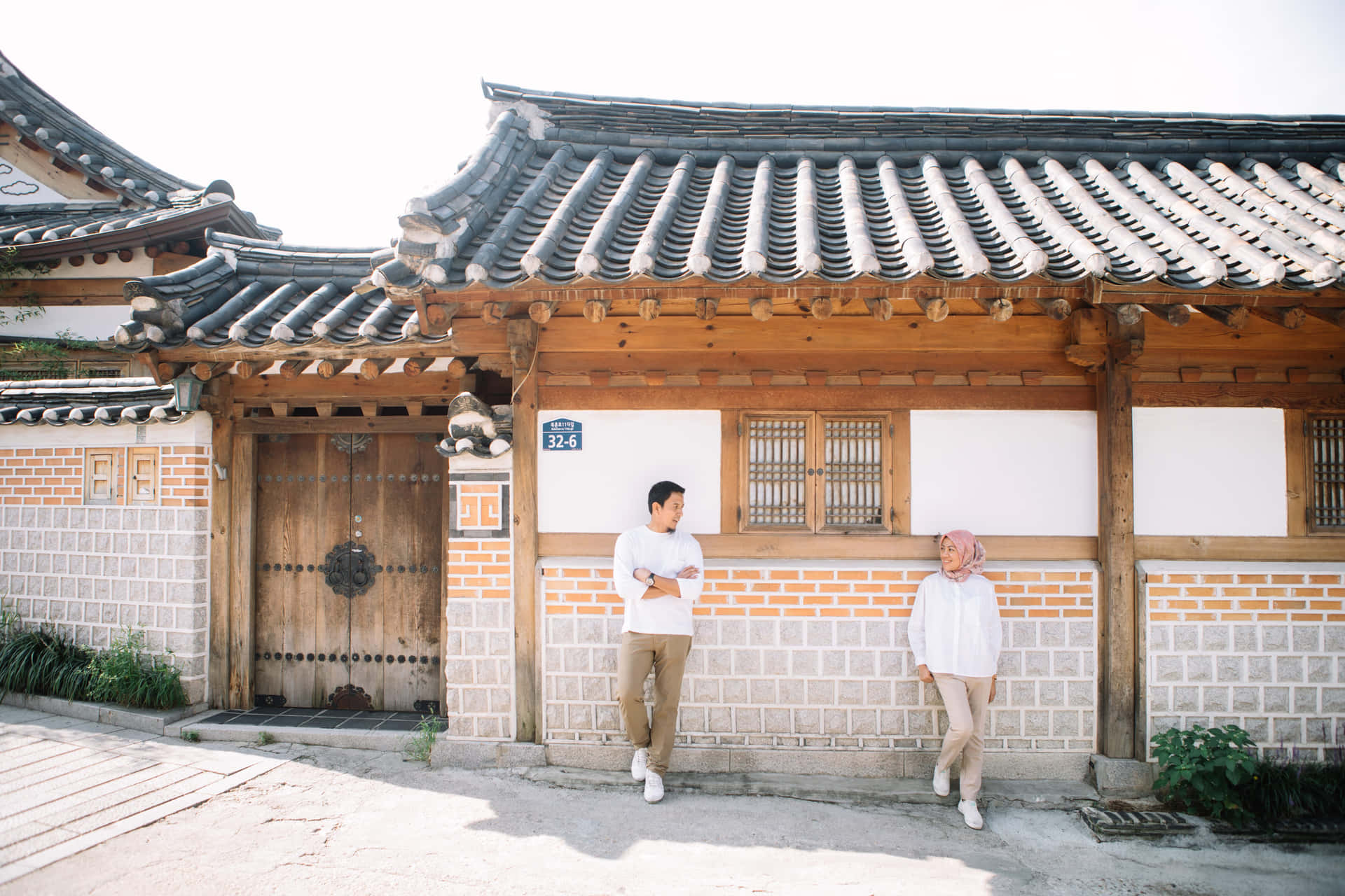 Bukchon Hanok Village Couple Strolling Wallpaper