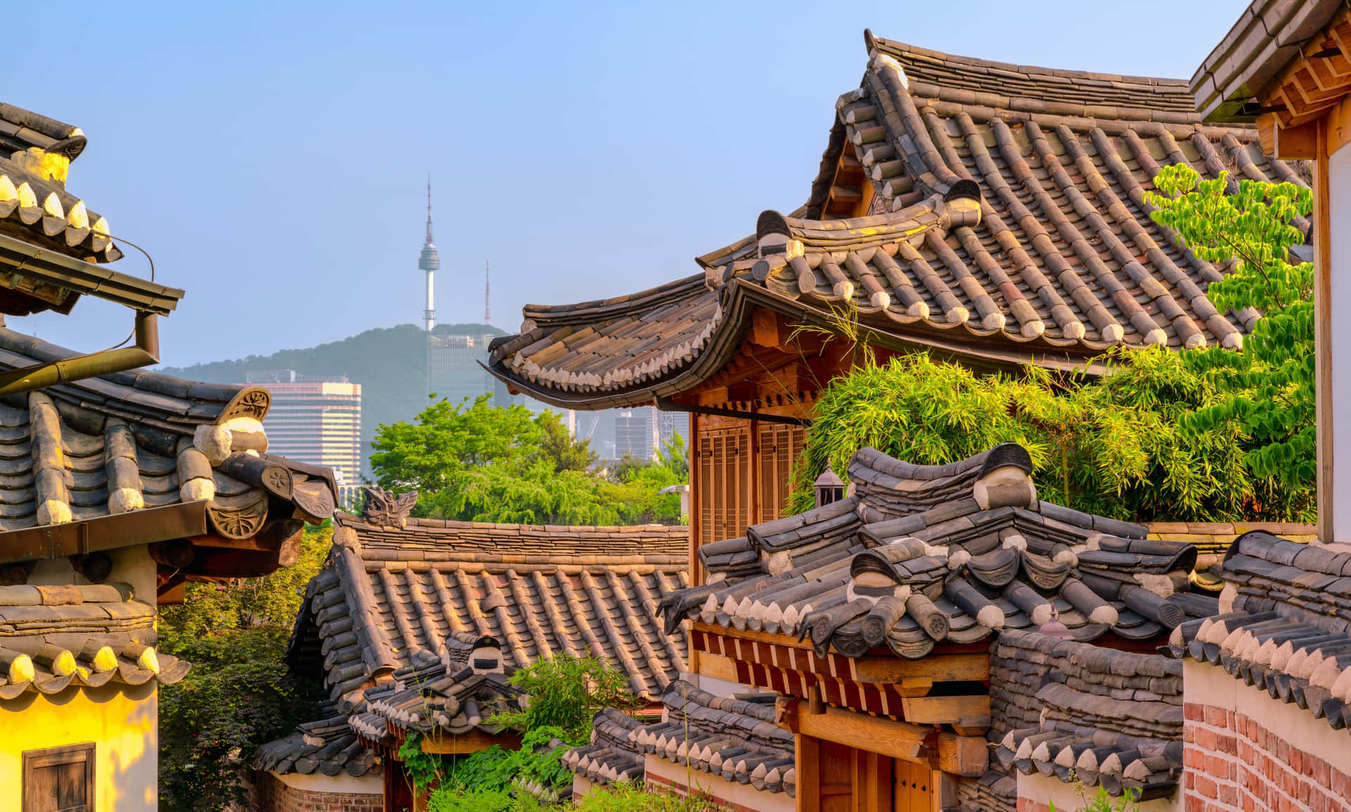 Bukchon Hanok Villagewith Seoul Tower Background Wallpaper