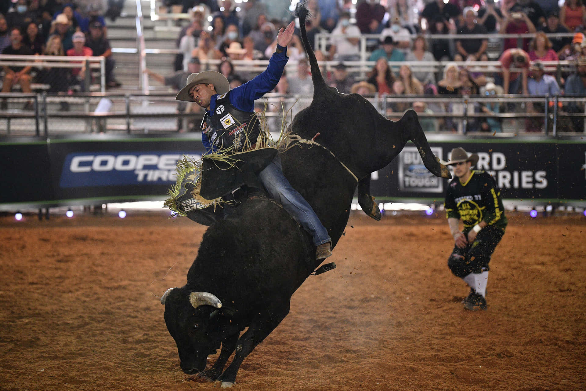A Bull Rider Fearlessly Take on the Threat of the Fierce Bull