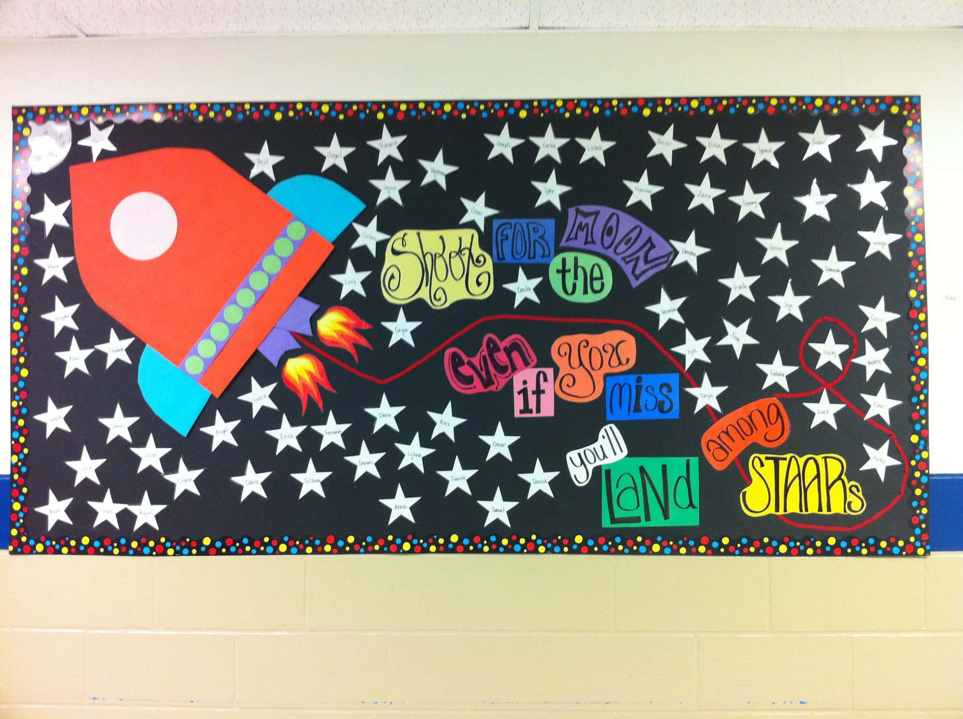 A Bulletin Board With A Rocket And Stars