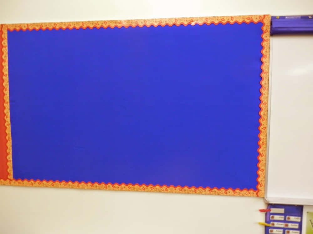 A Blue And Orange Bulletin Board With A Blue Frame