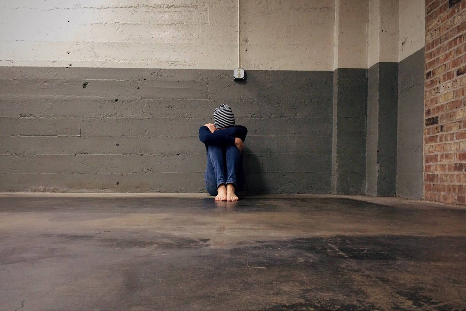 Bullied Lonely Woman In An Empty Room Wallpaper