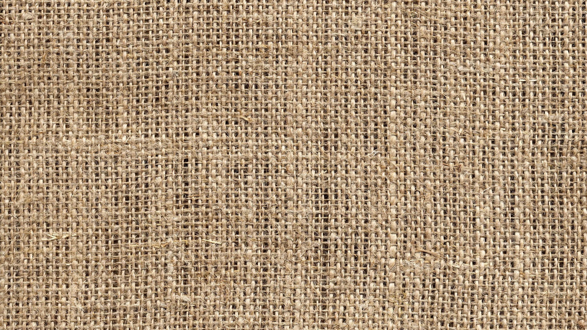 Burlap textured background in muted tans, browns, and whites.
