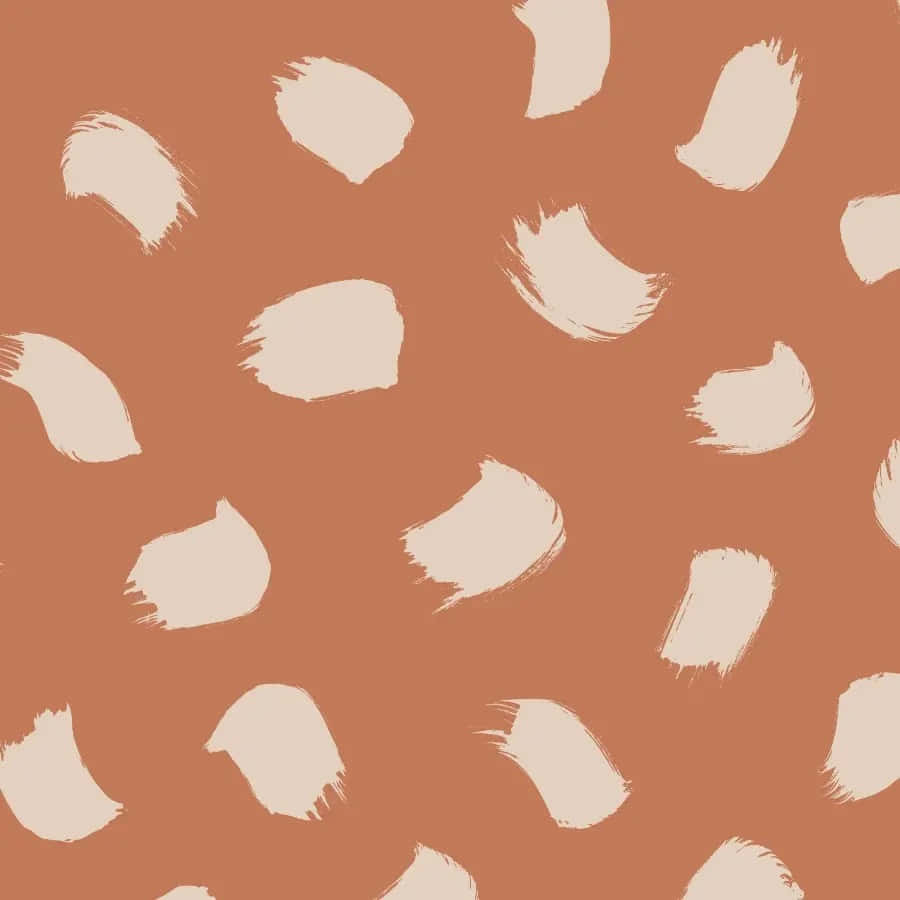 A Pattern Of Animal Splatters On A Tan Background