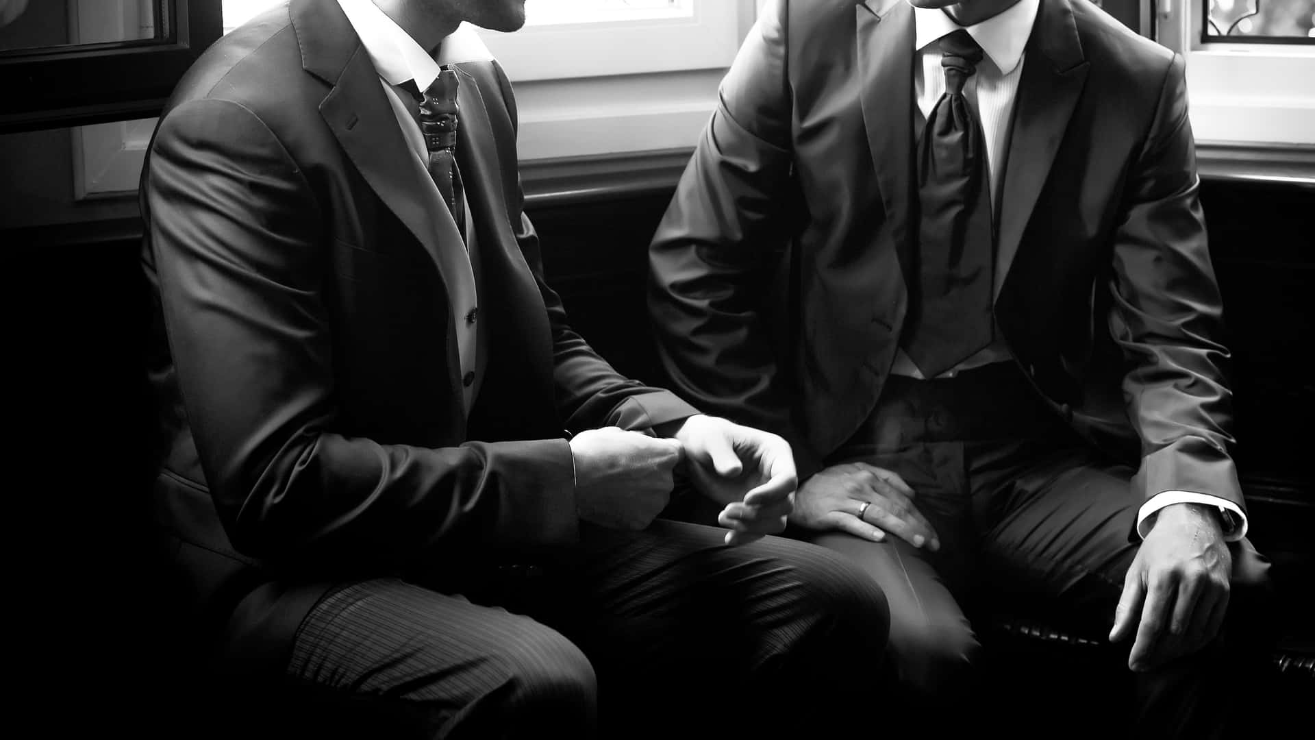 Business Men In Different Men Suit Styles Wallpaper