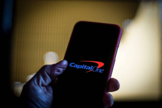 [business Person Using Capital One's Online Banking Service On Their Mobile Device] Wallpaper