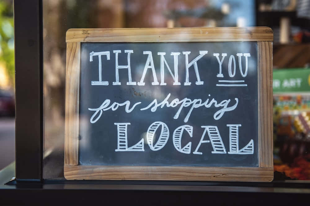 A Sign That Says Thank You For Shopping Local