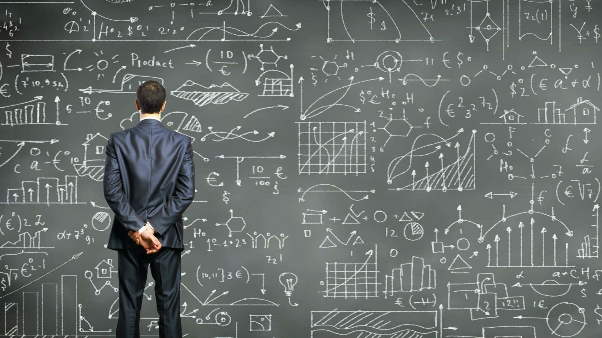 Businessman Analyzing Complex Data Chalkboard Wallpaper
